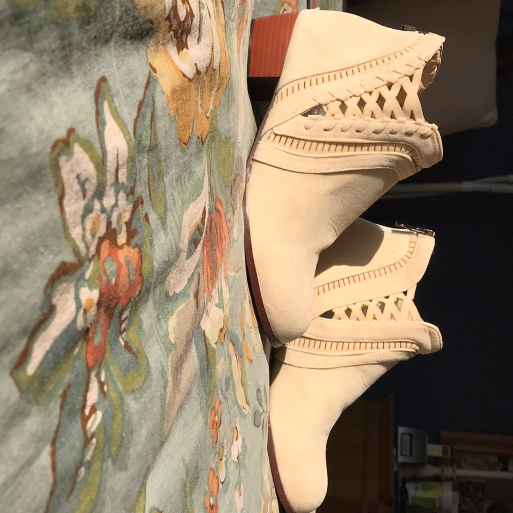 One pair of Beige man made suede ankle boots.